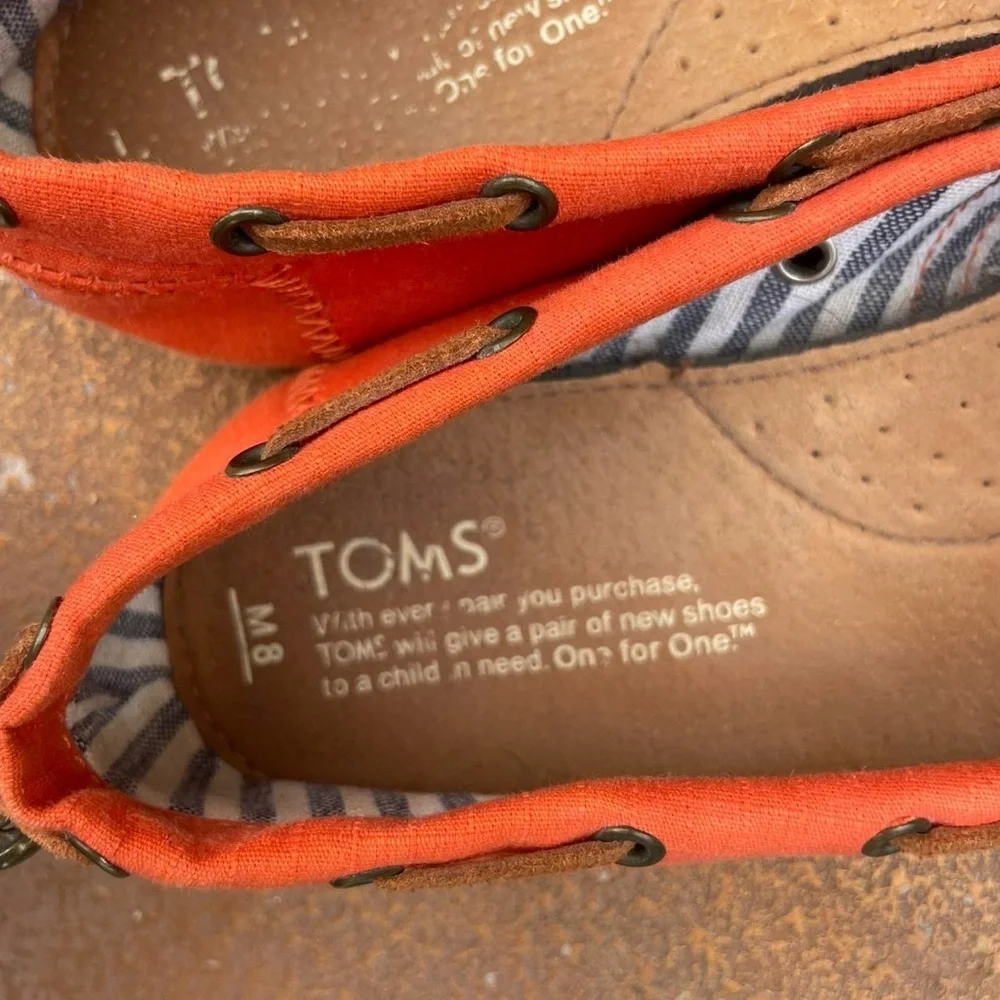 Orange TOMS slip-on shoes men’s size 8